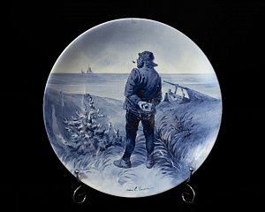Тарелка "Рыбак с трубкой". Голландия, Делфт, фирма "Joost Thooft & Labouchere", художник E. Verveer, конец XIX века.